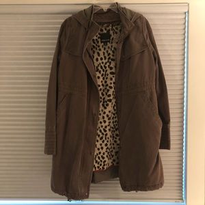 Utility jacket with leopard faux fur lining